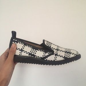 black and white woven leather flats